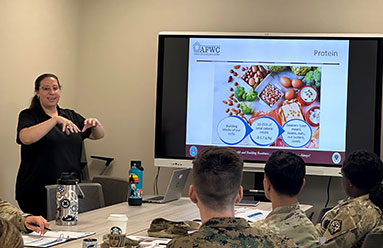 Woman leading a cass on Nutrition at an Armed Forces Wellness Center