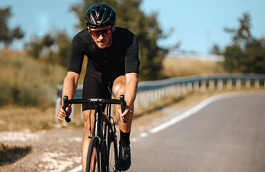 Man cycling on an empty road