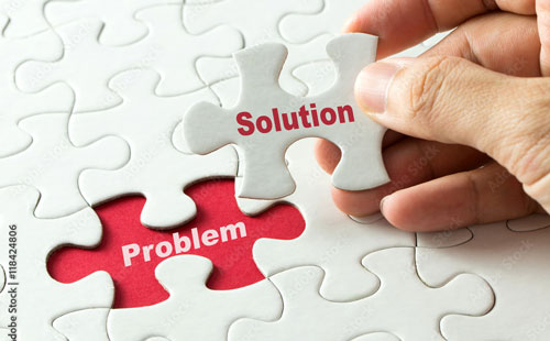 Image of a puzzle, a piece is missing revealing the word problem, the piece that fits says solution