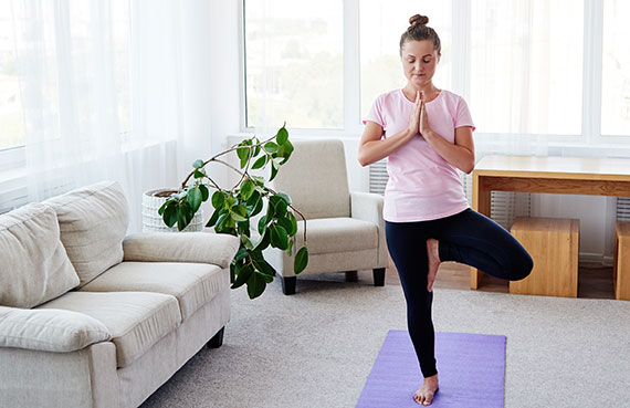 Woman doing Yoga in Tree Pose