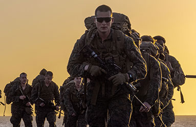 Active Duty Service Members lined up, saluting