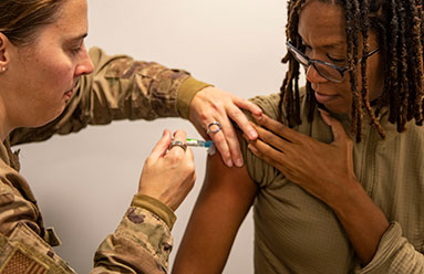 Service member getting vaccinated