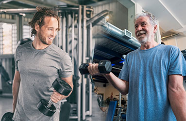 Young man doing bicep curls next to an older man doing bicep curls