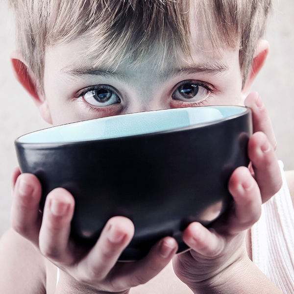 Kid with empty bowl